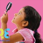 child using a magnifying glass