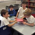 Boys pulling books