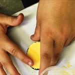 children pressing bath bomb