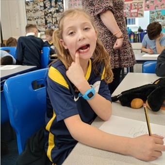 Girl touching her tooth